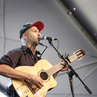 Tom Morello Rocks the Crowd with His Electric Guitar and Microphone