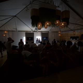 Chandelier Shines over Crowded Tent