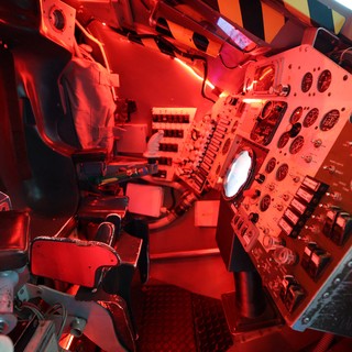 Interior of Historic Aircraft Cockpit with Red Lighting