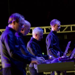 A Group of Musicians Rocking the Keyboard