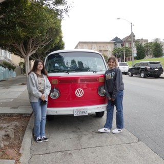 Friends Posing with Classic Volkswagen Bus