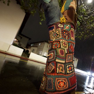 Colorful Crocheted Tree Cozy on Rainy Night