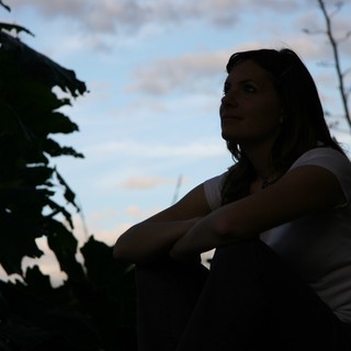 Contemplative Woman Gazing at Twilight Sky