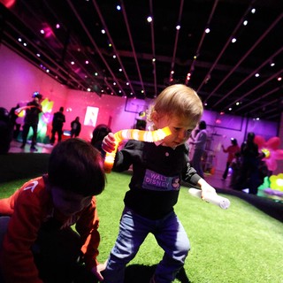 Children Playing at Baby Rave Event with Colorful Lighting