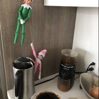 Elf on the Shelf Brewing Up Some Magic on the Coffee Maker