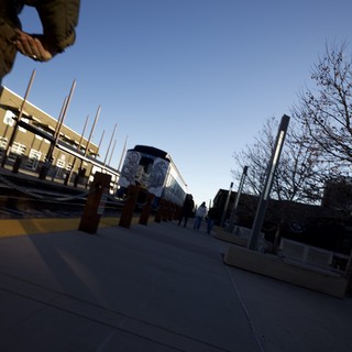Low Angle Urban Plaza with Train Mural at Dusk