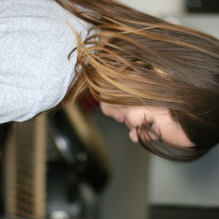 Woman Smiling in Kitchen with Ombré Hair