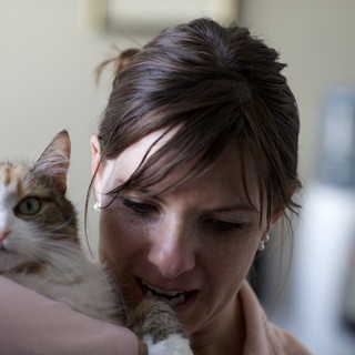 Woman and Tabby Cat Share a Tender Moment