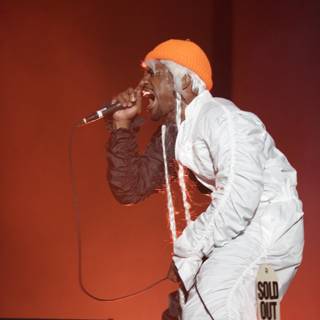 Entertainer in White and Orange Performs at Coachella