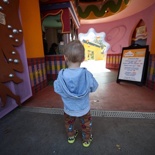 Young Child Explores Colorful Fantasyland Play Area