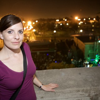 Woman Smiling at Outdoor Night Festival Overlook