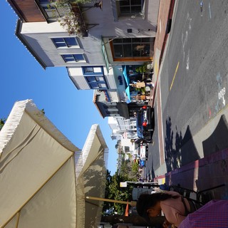 Sunny Coastal Town Street Scene with Umbrella