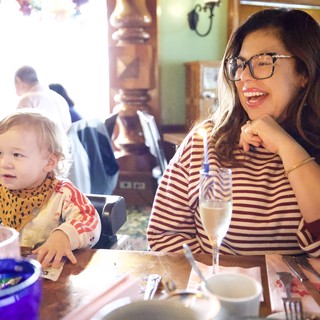 Mother and Child Dining at Restaurant Interior