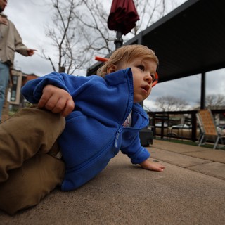 Young Child Playing on Outdoor Patio in Winter