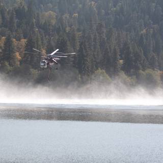 Helicopter and Fire Truck Fly Over Lake