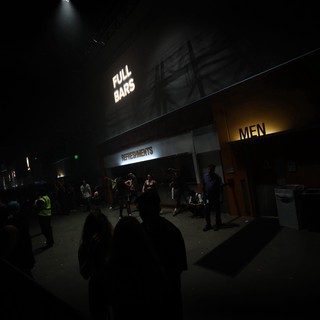 Neon Signs Glow at Wobbleland Festival Concourse