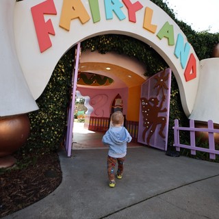 Child Entering Pixie Hollow Fairyland Attraction Entrance