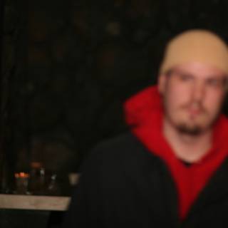 Blurry Snapshot of a Red Jacketed Man