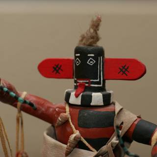 Tiny Native American Doll with a Red Hat