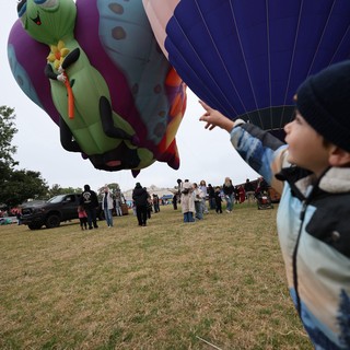 Child's Wonder at Hot Air Balloon Festival Launch