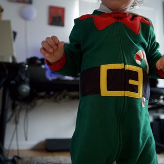 Toddler in Festive Elf Costume at Home