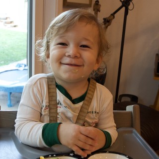 Toddler's Joyful Mealtime During Christmas Season
