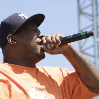 Tyree Guyton Performs at Coachella in Orange Shirt