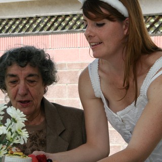 Grandmother and Bride Sharing a Celebratory Cake Moment