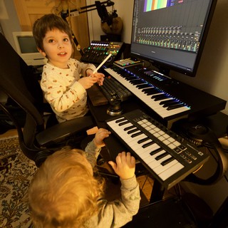 Young Children Learning Music Production at Home Studio