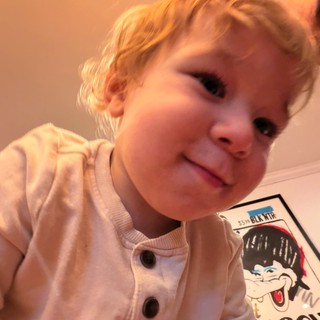Young Child in Cozy Pink Outfit at Home