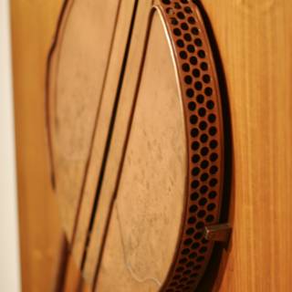 The Brown Metal Drum on the Wooden Wall