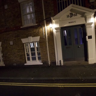 Historic London Building Entrance at Night - Block C 1888