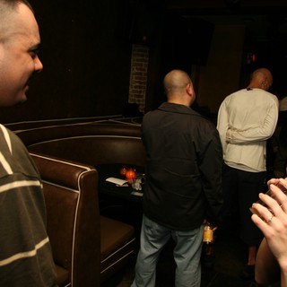 Late Night Lounge Gathering in Dim Club Setting