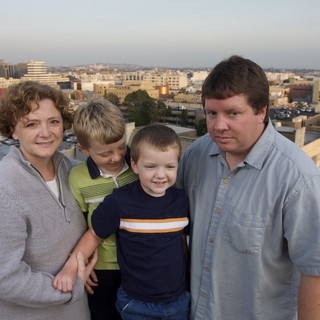 Family Portrait on Urban Rooftop at Dusk