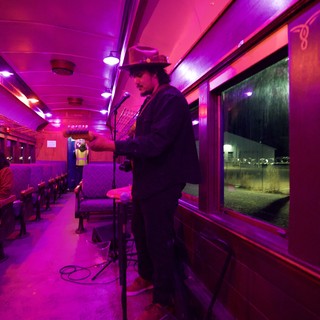 Late Night Diner Car with Vibrant Pink Lighting