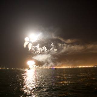 Fireworks Illuminate the Night Sky over the Ocean