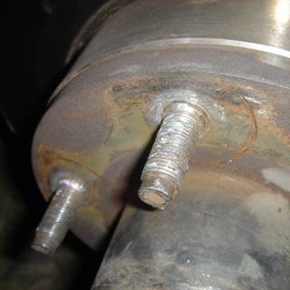 Rusted Brake Rotor with Bolt and Two Screws