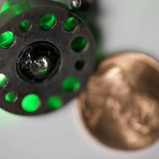 Close Up of a Coin and Green Light
