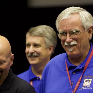 Three Happy Men in Blue Shirts and Mustaches