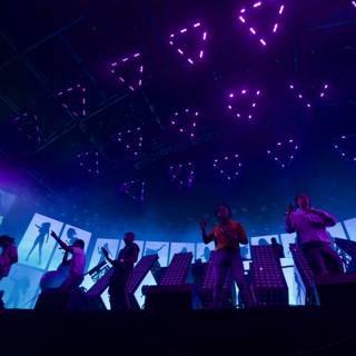 Group Performance Under Purple Lights