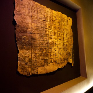 Ancient Chinese Oracle Bone Script Tablet on Display