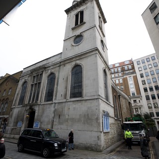 Historic Church Tower Among Modern London Buildings