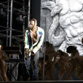 Kanye West performs with dancers on stage