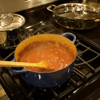 Homemade Tomato Sauce simmering on the Stove