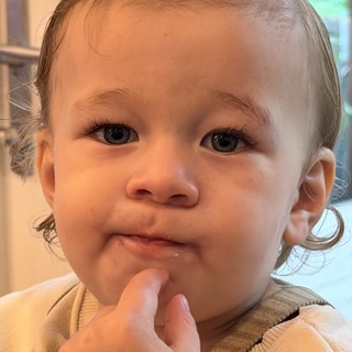 Innocent Blue-Eyed Child in Gentle Contemplation
