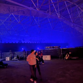 Blue-Lit Warehouse Rave Before Electronic Music Performance