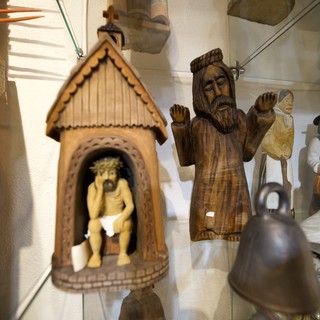 Collection of Folk Art and Religious Wood Carvings Display