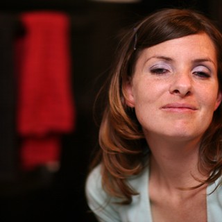Contemplative Woman in Soft Indoor Light
