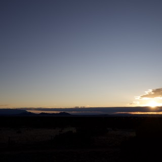 Sunset Over Desert Mountains and Scrubland