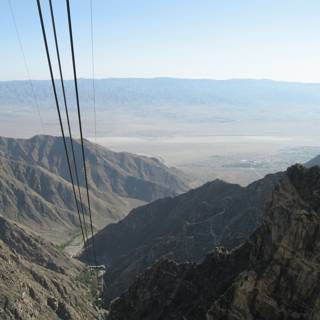 Title: Cable Car Ride Over the Majestic Mountain Range
